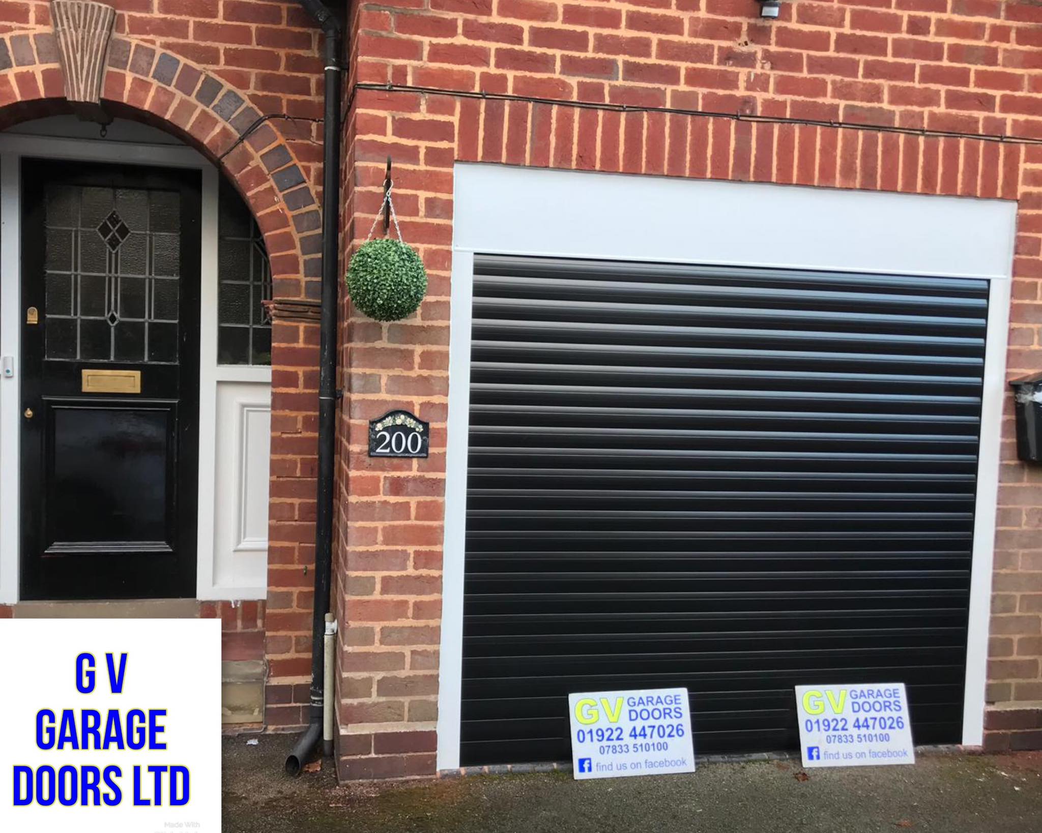 black garage door with 'GV Garage Doors' signage